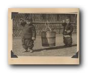 066 - Chinese Children carrying Honey Bucket.jpg